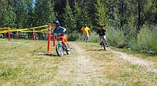 Roper Edwards, of Moise, jumps out to an early lead during his qualifying ride during the BMX bike race.