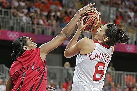 &lt;p&gt;Turkey forward and former North Idaho College standout Tugce Canitez hangs onto the ball as she is pressured by Angola forward Angela Cardoso during a basketball game at the Olympics in London. Canitez finished with three points and six rebounds as Turkey won 72-50. Turkey plays the United States on Wednesday.&lt;/p&gt;