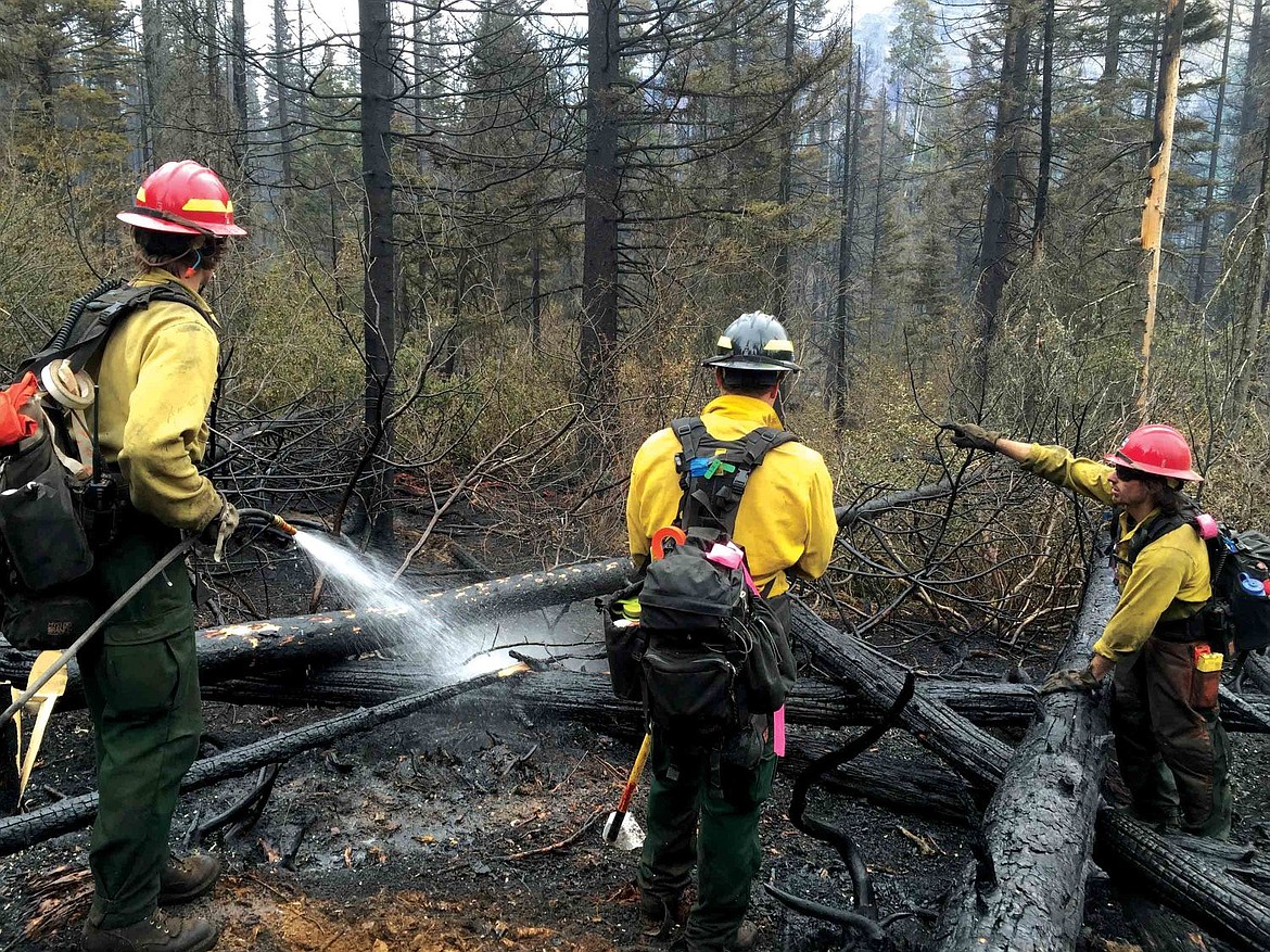 &lt;p&gt;&lt;strong&gt;Firefighters work&lt;/strong&gt; on hot spots on the 3,170-acre Reynolds Creek Fire in Glacier National Park. (Photo courtesy of Reynolds Creek Fire)&lt;/p&gt;