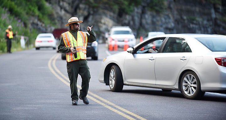 &lt;p&gt;A park official keeps count of the number of cars going up to Logan Pass as vehicle numbers are closely monitored on Wednesday, July 29, in Glacier National Park. (Brenda Ahearn/Daily Inter Lake)&lt;/p&gt;