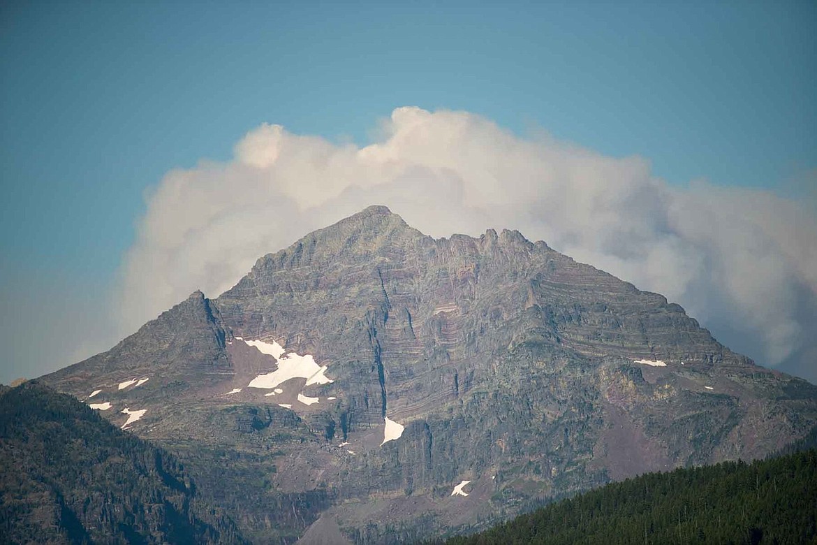 &lt;p class=&quot;p1&quot;&gt;Smoke from the Reynolds Creek Wildland Fire fire boils over Gunsight Peak in Glacier National Park Tuesday evening. The fire was reported mid-afternoon and grew to a reported 300 acres by 6 p.m.&lt;/p&gt;