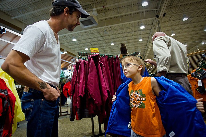 &lt;p&gt;Decker Weill, 8, tries on a jacket alongside his father, Troy Weill, while being treated to a shopping spree Wednesday by Cabela's for gear that he'll use on an upcoming crab fishing trip. Wishing Star Foundation granted the boy his wish as he contends with stage 4 neuroblastoma.&lt;/p&gt;