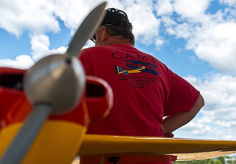 &lt;p&gt;The Coeur d'Alene Aero-Modeling Society President, Bob Scott, stands in front of his model Shoestring airplane. Scott and other members of CAMS participated in a show for special needs kids on Tuesday afternoon.&lt;/p&gt;