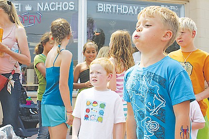 &lt;p&gt;Kayne Kirwan takes a deep breath before spitting his cherry during the cherry pit spiting competition on Saturday.&lt;/p&gt;