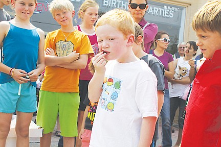 &lt;p&gt;Grady Fields, who was visiting his grandfather from Washington last weekend, prepares himself for competition while eating the fruit of his cherry.&lt;/p&gt;