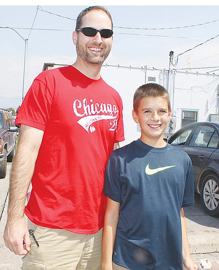 &lt;p&gt;Father-son duo Troy and Bladen Flynt pose together. Both Flynt men were champions of the pit spitting competition and the elder Flynt also took home the title in cherry stem tying.&lt;/p&gt;