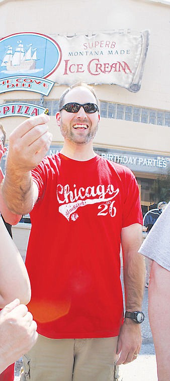 &lt;p&gt;Troy Flynt of York, Nebraska shows off the cherry stem he successfully tied with his tongue. Flynt was the champion of both the cherry stem tying and the adult cherry pit spitting competitions.&lt;/p&gt;