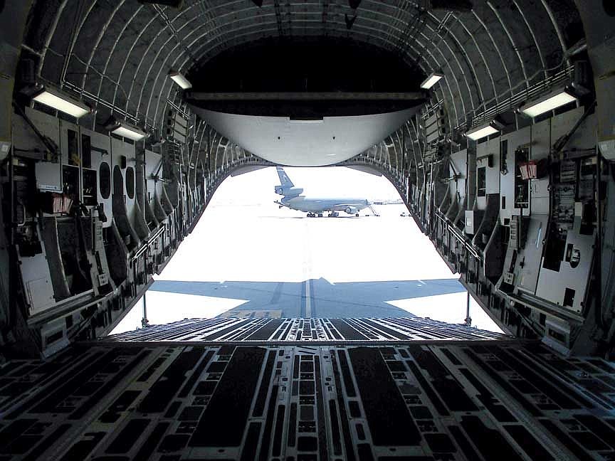 Cargo can be loaded using the ramp of a C-17. The aircraft seen in the distance is a KC-10, which we hope will be stationed at Fairchild AFB in the future.