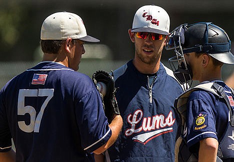 &lt;p&gt;Coeur d'Alene Lumbermen head coach Zach Clanton, center, speaks with pitcher Dominic Conigliaro and catcher Grant Wade during the second inning against the Boise Gems.&lt;/p&gt;