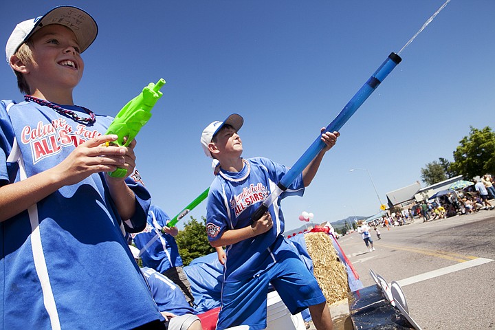 &lt;p&gt;Caleb Dewbre, 13, left, and Wyatt Green, 12, spray spectators
with water guns during the Columbia Falls Heritage Days Parade
Saturday afternoon.&lt;/p&gt;