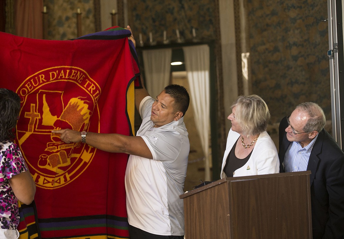 &lt;p&gt;Coeur d'Alene Tribe Chairman Chief James Allan, middle, presents both Vicki Risch, second from right, and Senator Jim Risch, far right, with a Pendleton Blanket as he explains the significance and ties of the Tribe to the Catholic Church and the Jesuits' long history of commitment to the Tribe.&lt;/p&gt;