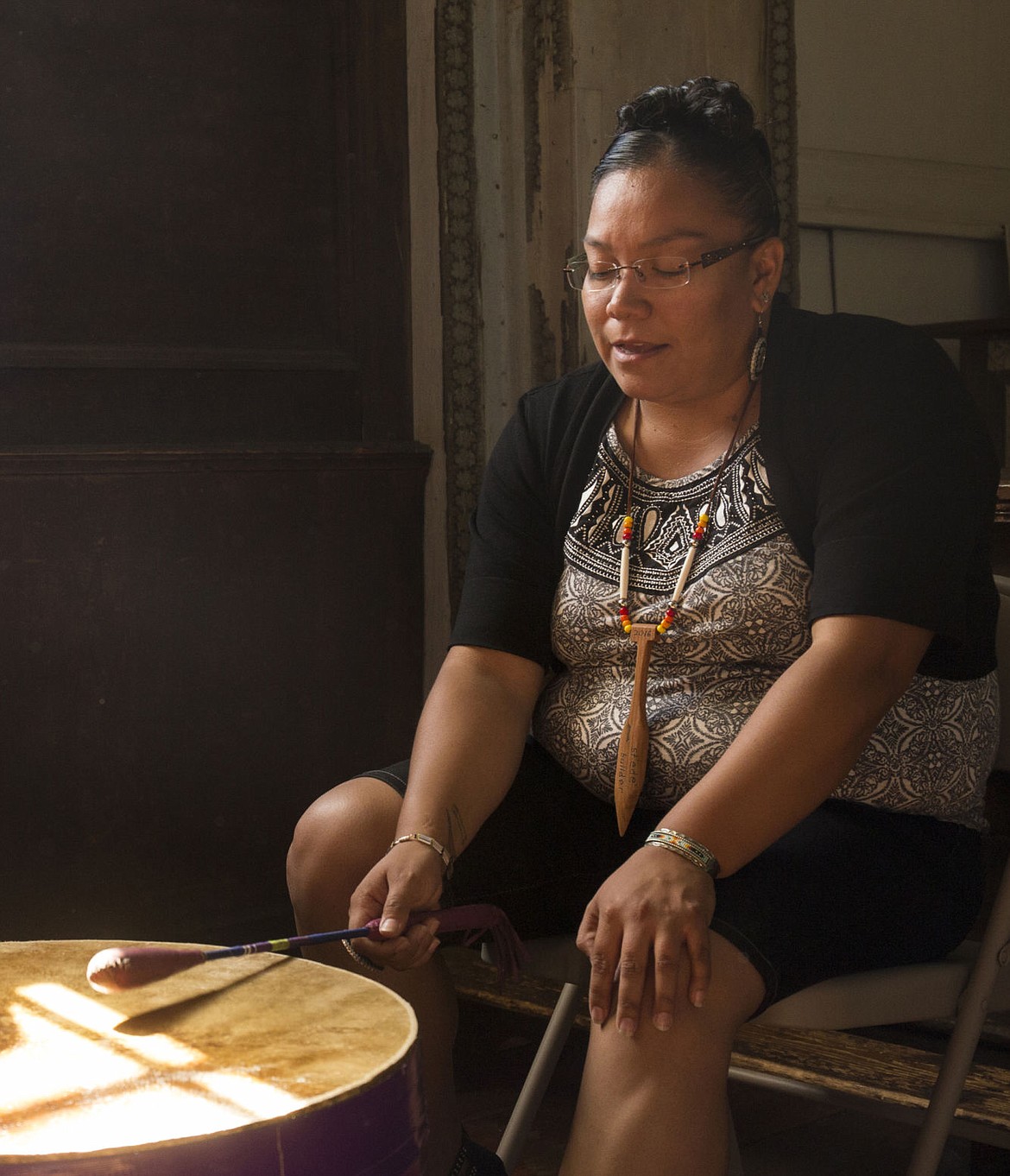 &lt;p&gt;Andy Rae Zachary of the Coeur d'Alene Tribe plays an honor song with the Rose Creek Singers during the Old Mission commemoration event on Friday.&lt;/p&gt;