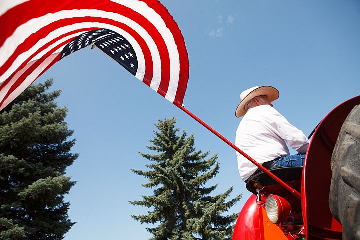 &lt;p&gt;Donald Reynolds sits on a McCormick diesel tractor Saturday afternoon before the Heritage Days parade in Columbia Falls Saturday, July 28, 2012 in Columbia Falls, Montana. (Reprints of this photo are available at&#160;&lt;strong&gt;http://tinyurl.com/heritageflag)&lt;/strong&gt;&lt;/p&gt;