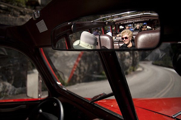 &lt;p&gt;Beverly Gaussiran of Sun City Center, Fl. and passengers take in the views as the Big Red Bus makes its way up Going to the Sun road in Glacier National Park on July 23. The fleet of 33 Red Buses have been in use since 1936.&lt;/p&gt;