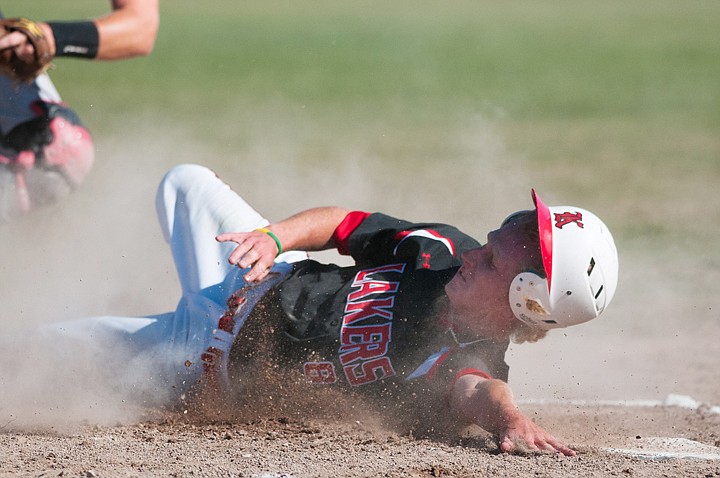 &lt;p&gt;Patrick Cote/Daily Inter Lake Kalispell Lakers' Dillon Matteson slides safely into home plate to put the Lakers up by three in the first inning Wednesday evening during the first game of a Lakers Twins doubleheader at Griffin Field. Wednesday, July 25, 2012 in Kalispell, Montana.&lt;/p&gt;