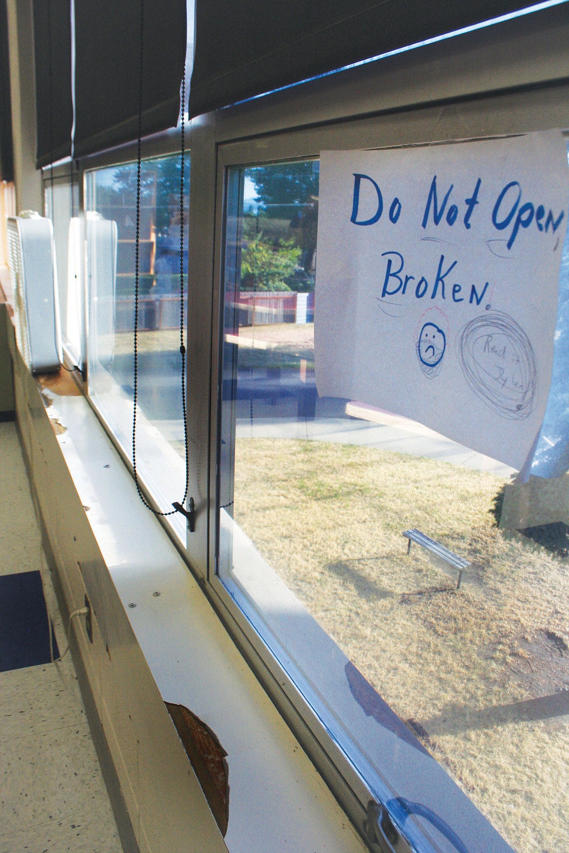 <p>A broken window is seen during a tour of Bigfork High School July 30. Bigfork School District is asking voters to approve a $14 million bond in a mail ballot election. Of the $14 million, about $5.4 includes deffered maintenance.</p>