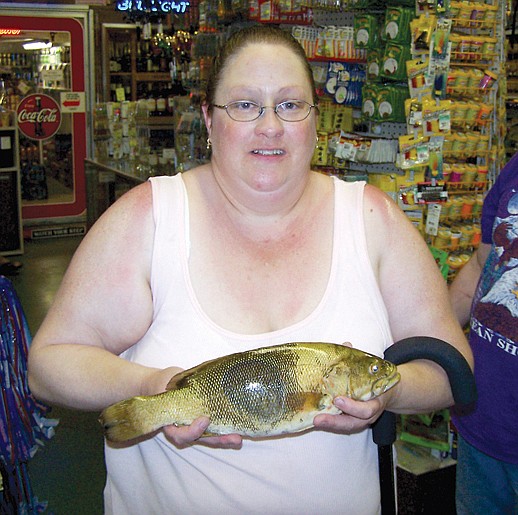 Courtesy photo Roslyn resident, Teresa Allen, fished the face of
the dam for this nice smallmouth bass.