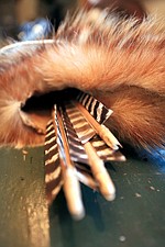 Cahoon prefers to use small-diameter wild rose shoots for his arrow shafts and wild turkey feathers as fletching. These finished arrows rest in a badger quiver.