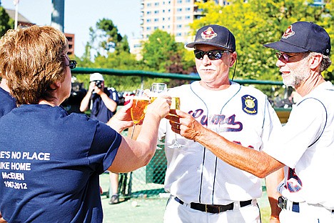 &lt;p&gt;Coach Lloyd Duman, right, and assistant coach Cory Bridges, middle, of the Coeur d'Alene Lumbermen shares a toast with Coeur d'Alene American Legion Baseball President Jamie Duman, left, and vice president, Phil Robbins (obscured) after the game against the Prairie Cardinals on Sunday afternoon. The game is likely to be the last ever played by the Lumbermen at McEuen Field.&lt;/p&gt;