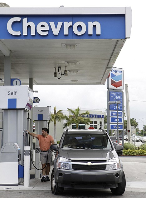 &lt;p&gt;A man fuels his car at a Chevron gas station in Miami on Tuesday. The economy slowed in the first six months of 2011 to its weakest pace since the recession ended. High gas prices and scant income gains forced Americans to sharply pull back on spending.&lt;/p&gt;