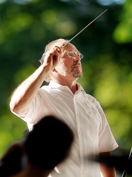 <p>John Zoltek directs the opening concert of Festival Amadeus 2012 at Depot Park in Whitefish. (Brenda Ahearn/Daily Inter Lake)</p>