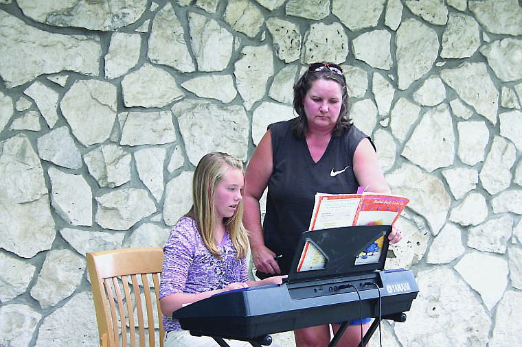 &lt;p&gt;Dakota Butcher, 11, plays On to Joy as Syd Connolly watches on.&lt;/p&gt;