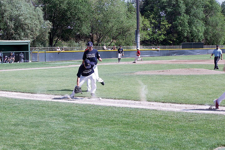 Pitcher Josh Snider and first baseman Kody Samuels watch a bunt attempt roll into foul territory.