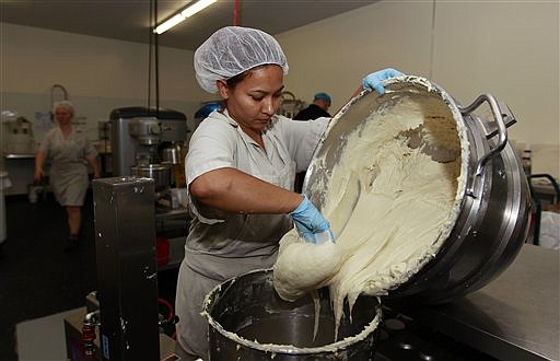 &lt;p&gt;In this Thursday, July 14, 2012 photo, Bertha Domimguez prepares gluten-free dough at Pure Knead bakery sandwich bread in Decatur, Ga. Scientists suggest that there may be more celiac disease today because people eat more processed wheat products than in decades past, which use types of wheat that have a higher gluten content. Or it could be due to changes made to wheat, said the Mayo Clinic's Dr. Joseph Murray. In the 1950s, scientists began cross-breeding wheat to make hardier, shorter and better-growing plants. It was the basis of a so-called &quot;Green Revolution&quot; that boosted wheat harvests worldwide. (AP Photo/John Bazemore)&lt;/p&gt;