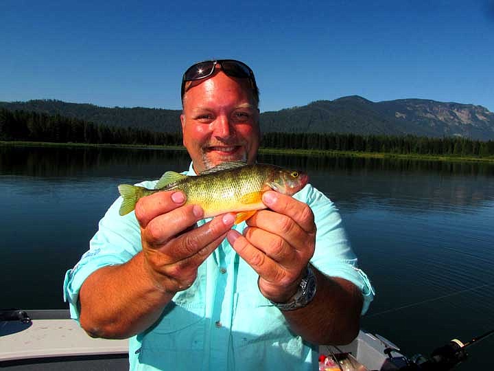 Eric Granstrom is pretty pleased with this yellow perch.&#160; He caught it while we were taping a new Fishing TV Show at Fish Lake.