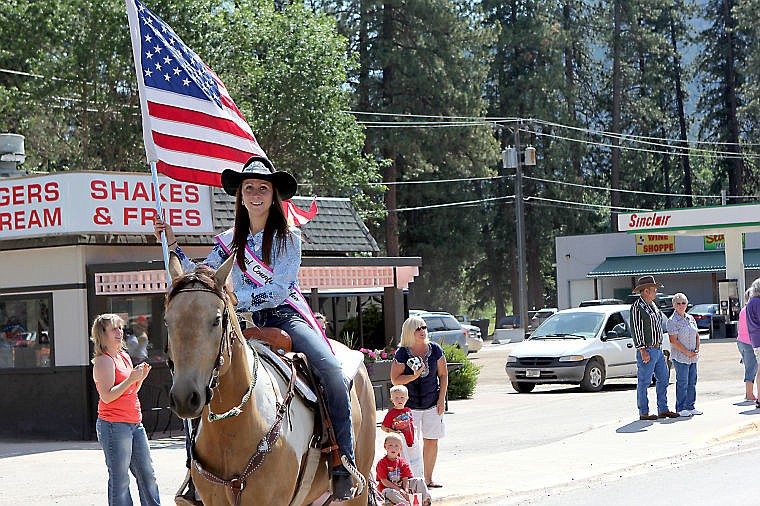 <p>Superior Lions Club Rodeo Queen Ashley Blaylock rides her horse during the Fourth of July parade.</p>