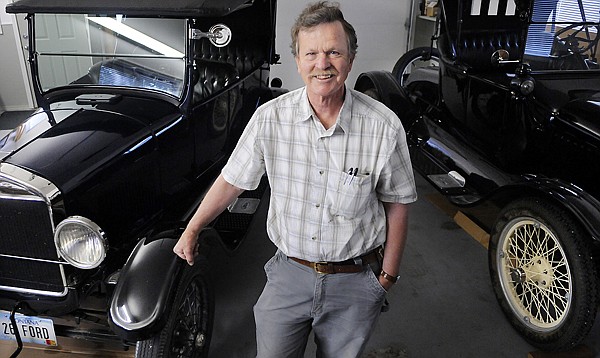 David Cooley with two of his Ford Model T's on the left, a 1926 convertible and on the right a 1920 model.