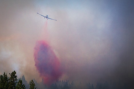 &lt;p&gt;A firefighting aircraft dumps retardant on a fire estimated to be five acres in size near Doubletree Road.&lt;/p&gt;