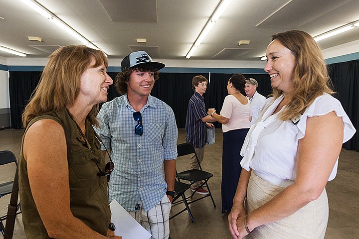 &lt;p&gt;SHAWN GUST/Press&lt;/p&gt;&lt;p&gt;Dustin Kegley, center, and his mother Sandy chat with Kim May, North Idaho Fair and Rodeo Foundation scholarship committee president, left, after four local students were presented with $1,000 college scholarships Friday at the Kootenai County Fairgrounds. The scholarships are raised from the foundation&#146;s annual Cowboy Ball event, sponsored by local businesses, including the Idaho Forest Group, Texas Roadhouse and Kootenai/Shoshone Farm Bureau Federation.&lt;/p&gt;