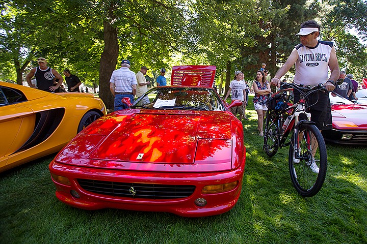 &lt;p&gt;TESS FREEMAN/Press&lt;/p&gt;&lt;p&gt;Slavko Kovacevic admires a 1996 F355 Berlinetta Ferrari at the &#147;Ferarris in the Park&#148; event hosted by the Members of the Northwest Region of the Ferrari Club of America. Seventeen cars participated in the event in City Park on Saturday morning.&lt;/p&gt;