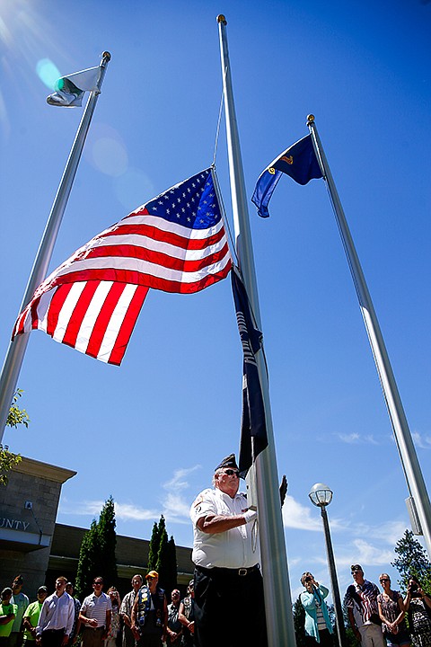&lt;p&gt;TESS FREEMAN/Press&lt;/p&gt;&lt;p&gt;Dave Sheldon&#160;of the Kootenai County Veterans Honor Guard raises the American flag in honor of Nick Newby and Nate Beyers who were killed in action on July 7, 2011. The flag will fly the month of July at the R.D. Rankin Veterans Memorial Plazaand before it is on display in the Hall of Heroes inside the Kootenai County Courthouse.&lt;/p&gt;