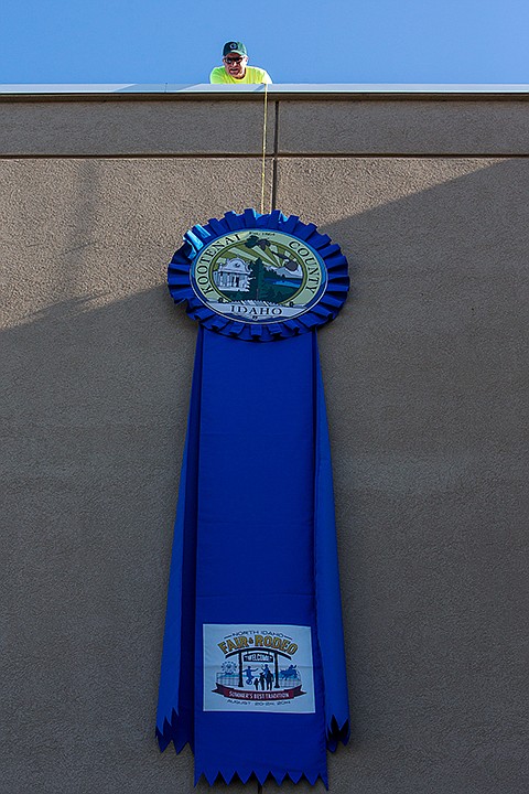 &lt;p&gt;TESS FREEMAN/Press&lt;/p&gt;&lt;p&gt;Shawn Riley, from the Kootenai County Building and Grounds Department,&#160;hangs the Kootenai County Fair and Rodeo ribbon outside the Kootenai County District Court on Thursday morning. The ribbon will hang outside the District Court building before moving to the Fairgrounds for the North Idaho Fair and Rodeo at the end of August.&lt;/p&gt;