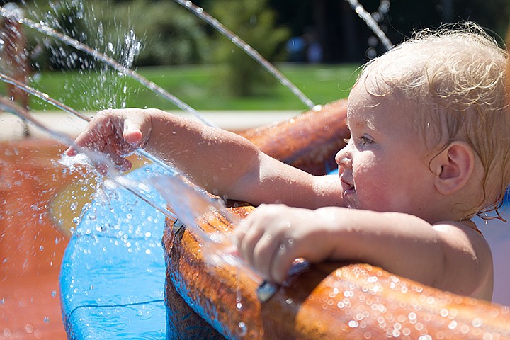 &lt;p&gt;MIKE CURRY/Press&lt;/p&gt;&lt;p&gt;Samantha Satterlund, 1, attempts to grab the water at the Splash Pad Tuesday at Mcquoin Park.&lt;/p&gt;