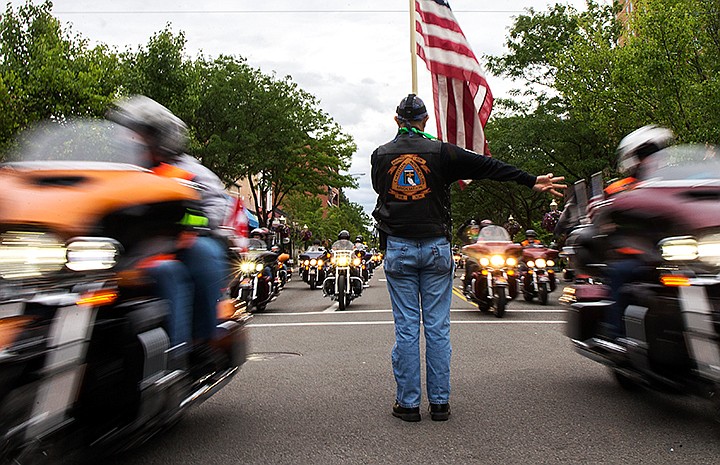 &lt;p&gt;TESS FREEMAN/Press&lt;/p&gt;&lt;p&gt;Dave Diehl from the Christian Motorcycle Association directs motorcyclists down Sherman Ave. for the Coeur d&#146;Alene Ride and Block Party on Thursday afternoon. Around 1,100 motorcyclists rode from the Lone Wolf Harley-Davidson dealership to Coeur d&#146;Alene to kick off the Pacific Northwest Harley Owners Group (HOG) Rally.&lt;/p&gt;
