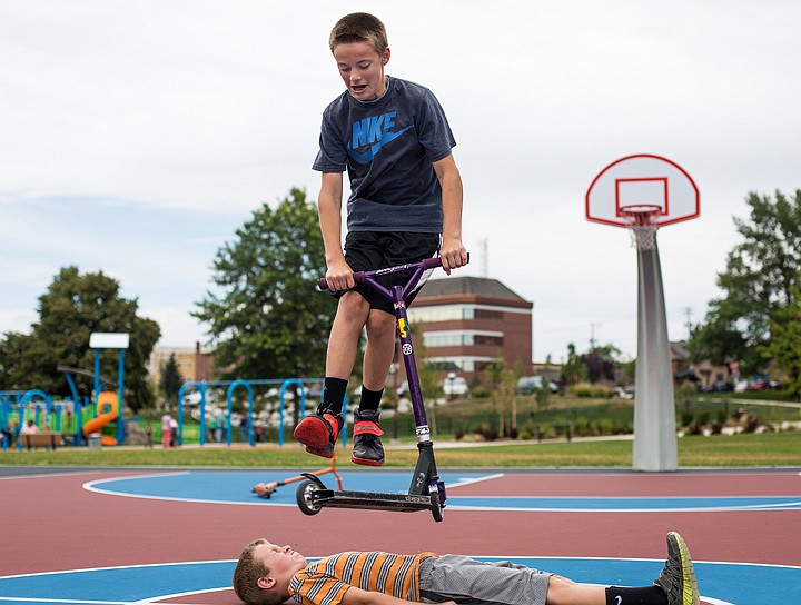 &lt;p&gt;JAKE PARRISH/Press&lt;/p&gt;&lt;p&gt;Hunter Hubbard, 13, soars over his younger brother Carter while performing a scooter trick on Tuesday at McEuen Park.&lt;/p&gt;