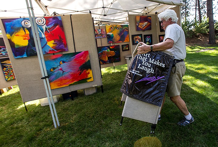 &lt;p&gt;TESS FREEMAN/Press&lt;/p&gt;&lt;p&gt;Jeff Leedy sets up his booth for the 46th annual Art on the Green this weekend at the NIC campus.&lt;/p&gt;