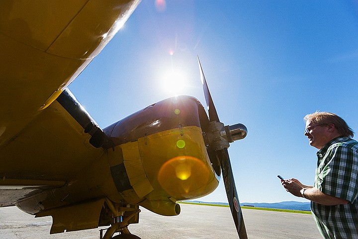 &lt;p&gt;SHAWN GUST/Press&lt;/p&gt;&lt;p&gt;Airplane enthusiast Tony Hattell checks out the prop engine of a Commemorative Air Force C-45 Monday at the Coeur d&#146;Alene Airport. The World War II transport aircraft is on display at Pappy Boyington Field until 6:00 p.m. July 9. Representatives expected its B-29, which was delayed for mechanical reasons, to arrive later.&lt;/p&gt;