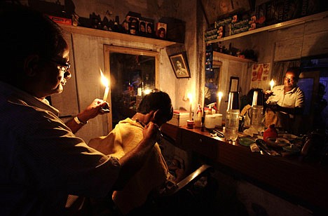 &lt;p&gt;An Indian barber holding a candle, has a haircut for a customer at his shop in Kolkata, India, Tuesday, July 31, 2012. India's energy crisis cascaded over half the country Tuesday when three of its regional grids collapsed, leaving 620 million people without government-supplied electricity for several hours in, by far, the world's biggest blackout. (AP Photo/Bikas Das)&lt;/p&gt;