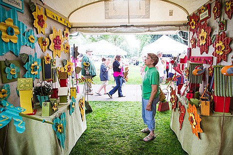 &lt;p&gt;Patty Johnson checks out the selection of handmade crafts at the Country Wreath booth at Taste of Coeur d'Alene.&lt;/p&gt;