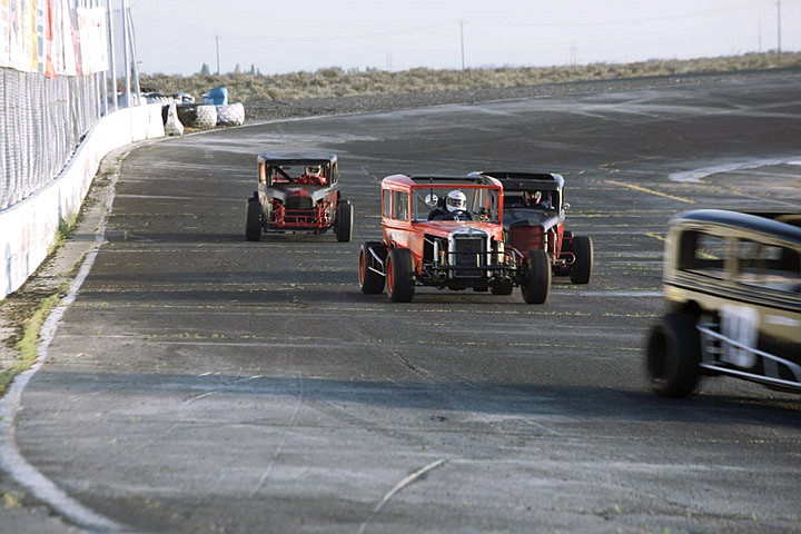 Drivers in the Northwest Early Stocks jockey for position as they round the far turn at the Ephrata Raceway Park Saturday.