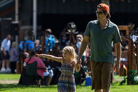 &lt;p&gt;Travis Lovejoy walks with his five-year-old daughter Georgia, during Art on the Green on NIC's campus on Friday afternoon.&lt;/p&gt;