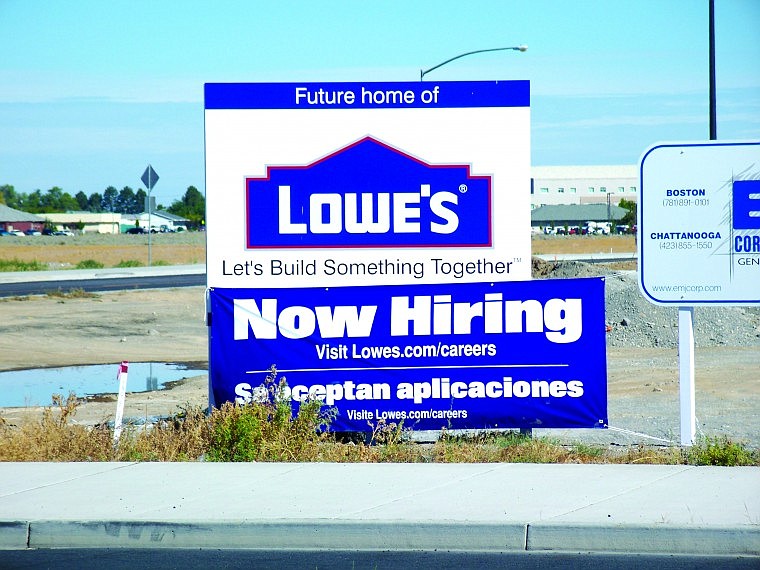 Lynne Lynch/Columbia Basin HeraldThe emerging Lowe&Otilde;s store on Yonezawa Boulevard will employ about 175 people and is expected to open in mid to late October, said Chris Ahearn, Lowe&Otilde;s vice president of public relations. A hiring sign posted at the work site directs interested applications to the company's Web site.