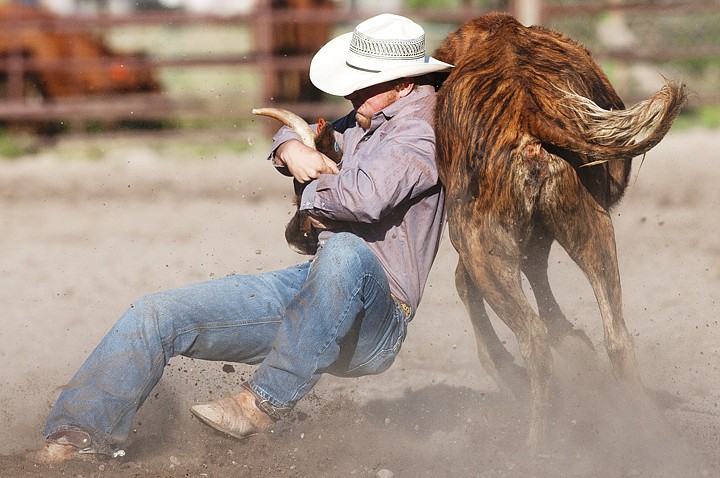 &lt;p&gt;Jake Andrews of Kalispell attempts to take down a steer during
the NRA Rodeo at the Blue Moon Arena Friday night.&lt;/p&gt;