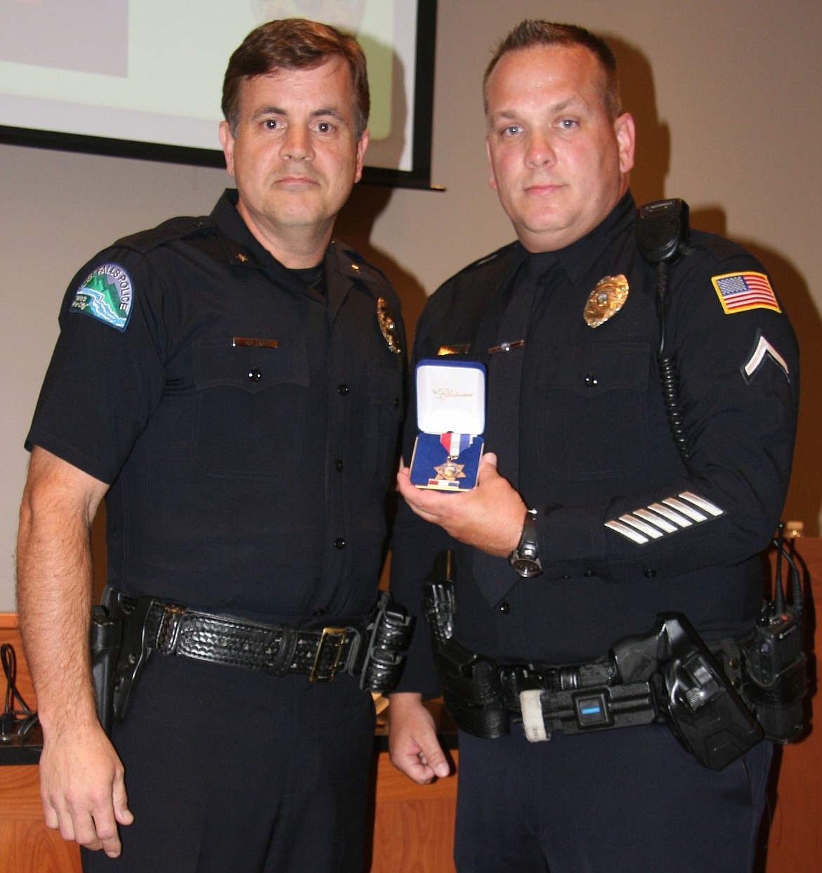 &lt;p&gt;Post Falls Police Officer Todd Flood, right, received a Life Saving Award from Chief Scot Haug at last week's City Council meeting for his efforts to revive Post Falls resident John Swalve.&lt;/p&gt;