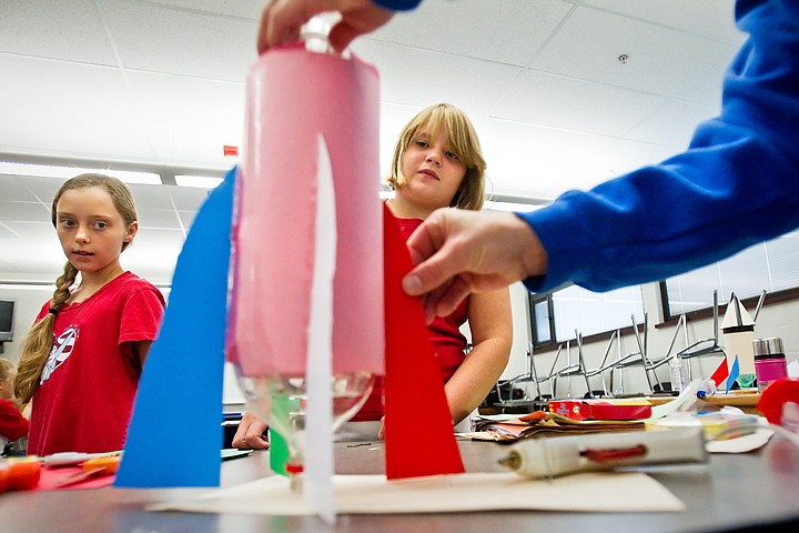 &lt;p&gt;SHAWN GUST/Press Anna Norton, right, watches as Lewis Clark State College teaching intern, Liz Smith, places fins on the soon-to-be fourth-grader's rocket Friday at River City Middle School as Morganne Nutt, left, looks on. The students have been participating in a 12-day science camp hosted by LCSC as a way to give its elementary education students practical classroom experience.&lt;/p&gt;