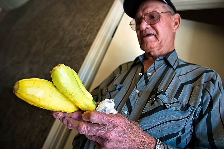 &lt;p&gt;BEN BREWER/Press Tex Cheatham of Post Falls proudly displays his unusual three-pronged straight-neck summer squash on Wednesday. Cheatham, who has planted summer squash in his Post Falls garden for the past fifteen years, had only ever seen two squash fused together and was shocked to find this little natural oddity in his own backyard.&lt;/p&gt;